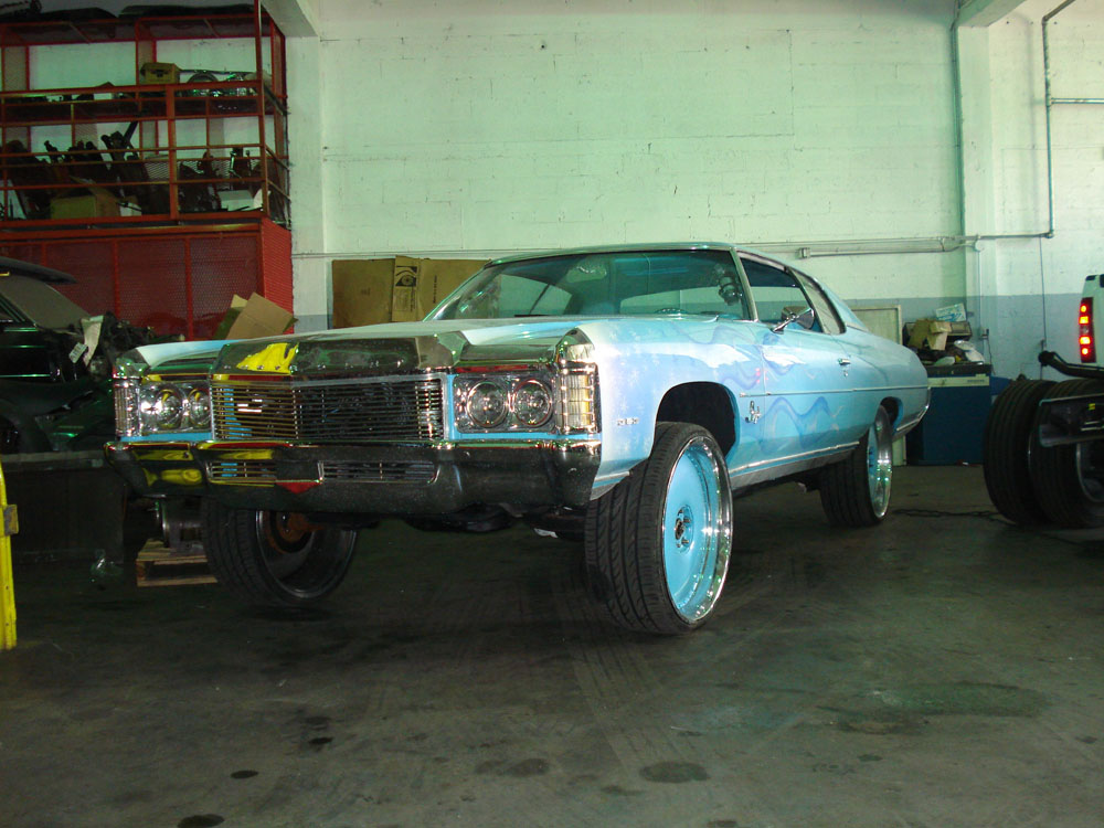 Build 002 — The Red Baron: 1988 Impala on 28 inch wheels with hydraulics