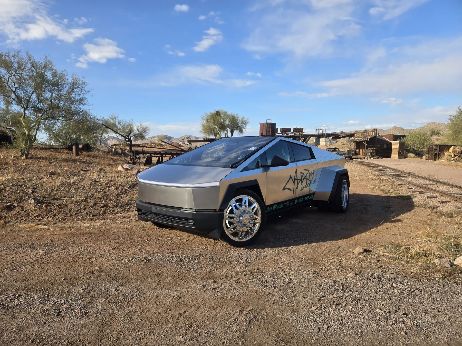 Cyber Dos Wheels Cyber Dually in a desert front three-quarter view with polished wheels