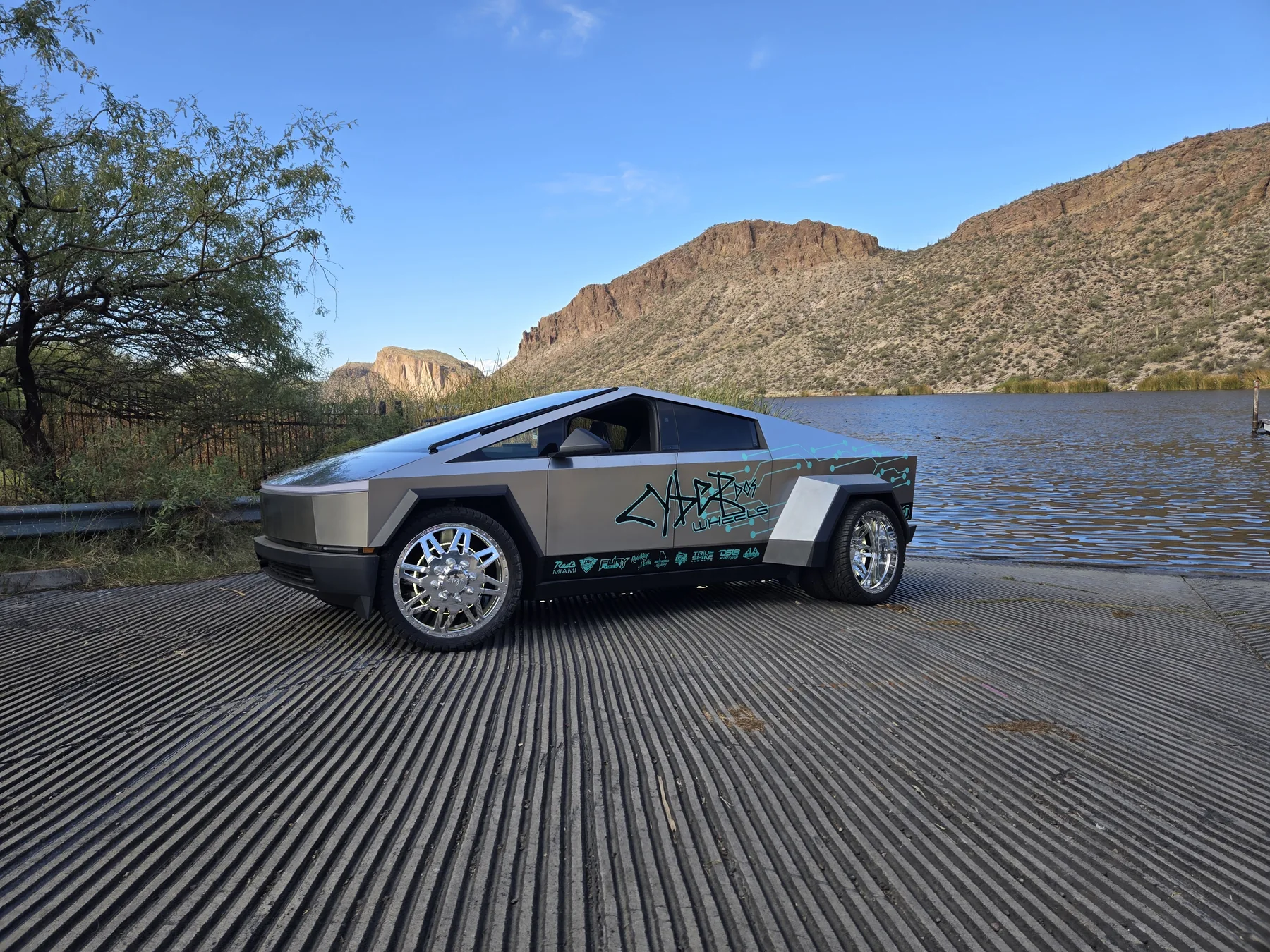 Cyber Dos Wheels Cyber Dually in side profile beside desert water and mountains
