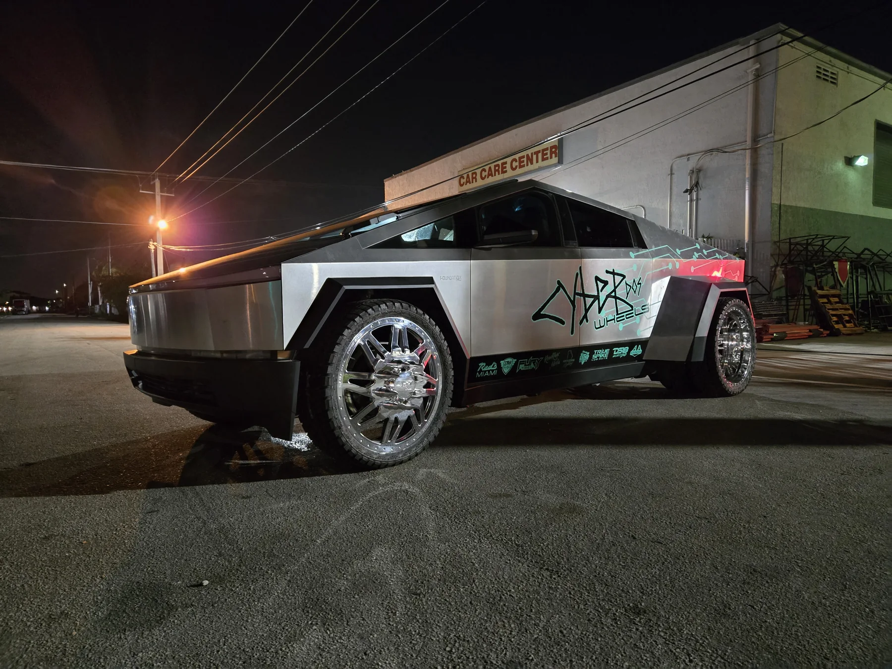 Cyber Dos Wheels Cyber Dually in side profile outside the Red’s Miami shop at night